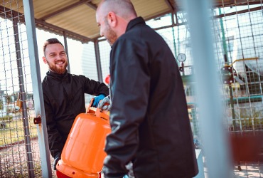 Two technicians performing a Propane Refill in Pontiac IL