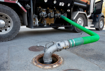 A tanker filling up a gas station during Gasoline Delivery in Peoria IL