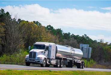 A tanker truck on the highway for a Propane Delivery to Pekin IL