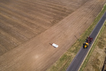 A tractor on the road benefits from Diesel Delivery in Tazewell County IL