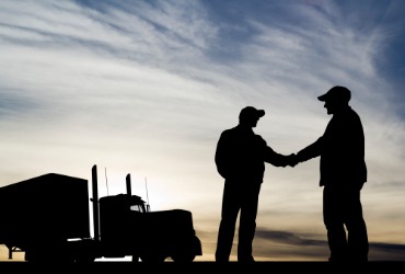 Men shake hands after receiving a Gasoline Delivery in Tazewell County IL