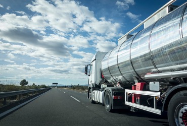 A delivery truck delivers gas, representing being a Propane Company for Woodford County IL