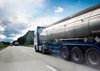 A truck drives down a highway, making a delivery from a top Propane Company in Tazewell County IL