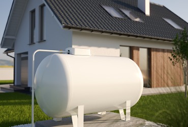 A propane tank sits near a house, ready to be filled from a Propane Company in Woodford County IL